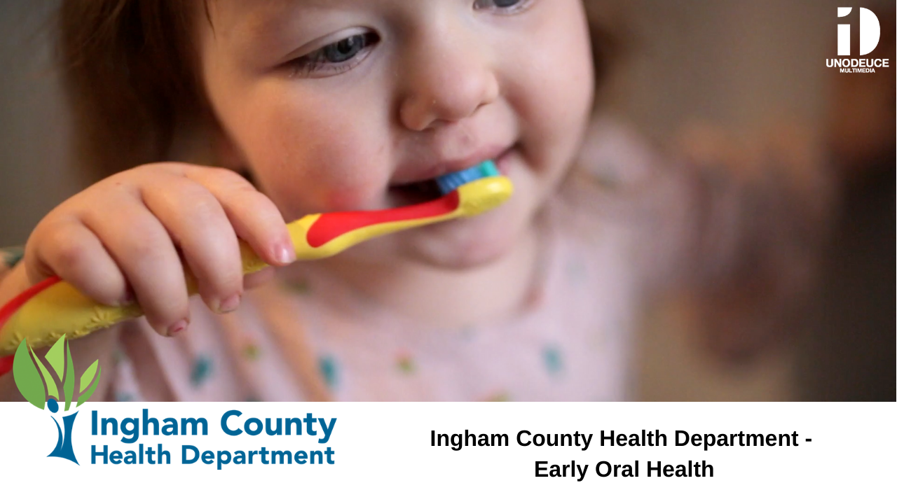 little girl brushing teeth